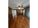 Spacious living room with hardwood floors, wood paneling and ample natural light at 3253 Centergrove Rd, Kannapolis, NC 28083