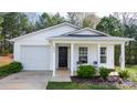 Inviting single story home featuring a covered porch and attached garage at 3944 Hemingway Nw Dr, Hickory, NC 28601