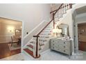 Elegant foyer with a classic staircase and marble flooring at 6910 Green Turtle Dr, Charlotte, NC 28210
