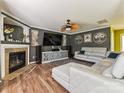 Modern living room showcasing a fireplace, TV, stylish decor, and a large sectional sofa at 7024 Sunman Rd, Charlotte, NC 28216