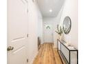 Bright entryway features wood floors, white walls, and a modern console table with decorative accents at 1032 Dooley Dr, Charlotte, NC 28227