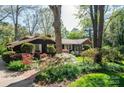 Well-maintained home with mature trees, manicured bushes, and blooming azaleas at 1213 10Th Street Nw Ln # 3, Hickory, NC 28601