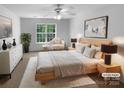 Bedroom virtually staged, featuring neutral paint, a ceiling fan, carpet and natural light at 1325 Crandon Dr, Charlotte, NC 28216