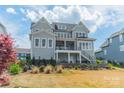 Expansive backyard with a multi-level patio perfect for outdoor entertaining and enjoying the view at 139 Little Indian Loop, Mooresville, NC 28117