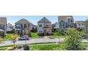 Well-manicured front yard with a modern two-story home featuring gray siding at 1519 Cedar Park Dr, Pineville, NC 28134