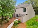Two-story townhome exterior showing manicured lawn, trees, beautiful landscape and modern architecture at 181 Riverview Ter, Clover, SC 29710