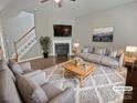 Staged living room featuring neutral colors, a fireplace, and a cozy rug at 1907 Caprington Dr, Fort Mill, SC 29707