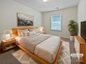 A staged primary bedroom featuring neutral tones and ample natural light at 1907 Caprington Dr, Fort Mill, SC 29707
