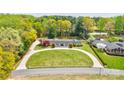 Aerial view showcasing the home's circular driveway and lush, mature landscaping at 316 Country Club Acres None, Shelby, NC 28150