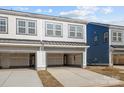 Spacious two-car garages with overhead doors in a modern townhome community at 5009 Cherry Gum Ct, Matthews, NC 28105