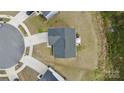 Aerial view of a home showing the roof, driveway, and surrounding landscaping at 5861 Camp Sw Ct, Concord, NC 28025