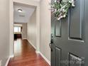 Welcoming foyer with hardwood floors and a view of the living area at 9551 Glenburn Ln, Charlotte, NC 28278