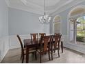 Elegant dining room with large arched windows and a classic chandelier at 116 Jim Parker Rd, Wesley Chapel, NC 28110