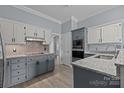 Well-lit kitchen featuring granite countertops and stainless steel appliances at 116 Jim Parker Rd, Wesley Chapel, NC 28110