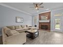 Comfortable living room with a brick fireplace and neutral decor at 116 Jim Parker Rd, Wesley Chapel, NC 28110