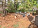 Enclosed patio area for outdoor relaxation, surrounded by lush greenery and a shade tree at 126 Pointer Se Ct, Concord, NC 28025