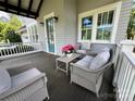 Inviting front porch with cozy seating, perfect for relaxing outdoors at 1550 Matthew Mcclure Cir, Davidson, NC 28036
