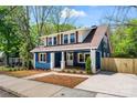 Stylish two-story blue home with manicured landscaping, a welcoming porch and new driveway is a must see! at 166 Franklin Nw Ave, Concord, NC 28025