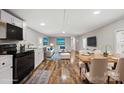 Inviting living and dining area with modern decor and wood-look flooring at 170 Dusty Loop Dr, Mount Gilead, NC 27306