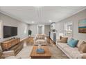 Staged living room features stylish furniture, wood flooring, and neutral decor at 170 Dusty Loop Dr, Mount Gilead, NC 27306