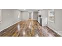 Open-concept space showcasing stylish wood-look floors and bright, neutral walls at 170 Dusty Loop Dr, Mount Gilead, NC 27306