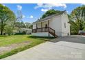 Quaint single-story home featuring a welcoming front porch and an expansive driveway at 1901 Parkdale Ave, Gastonia, NC 28052
