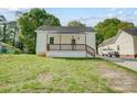 Inviting single-story house with a charming porch and a neatly kept front yard at 1901 Parkdale Ave, Gastonia, NC 28052