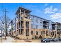 A modern apartment complex with blue and beige exterior and well-maintained landscaping at 2401 Euclid Ave, Charlotte, NC 28203
