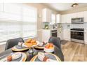 Cozy dining area showcasing modern decor, a table set with donuts and fresh fruit at 4628 Arthur Way, Rock Hill, SC 29732