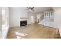 Bright, spacious living room with fireplace, hardwood floors, and ample natural light at 472 Bellingshire Dr, Mt Ulla, NC 28125