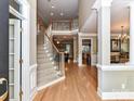 Spacious foyer with hardwood floors and staircase at 7012 Chadwyck Farms Dr, Charlotte, NC 28226