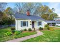 Inviting single-story home with manicured landscaping and a welcoming walkway at 713 8Th Street Nw Dr, Hickory, NC 28601