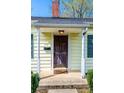Close-up of front door with 'hello' mat on a covered porch at 713 8Th Street Nw Dr, Hickory, NC 28601