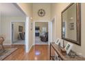 Bright foyer featuring hardwood floors, neutral walls, and entryways to living spaces, creating a welcoming ambiance at 921 Snow Prince Ln, York, SC 29745