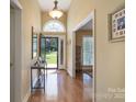 Spacious foyer with light-colored walls and hardwood floors leading to various rooms of the home at 921 Snow Prince Ln, York, SC 29745