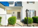 Charming front porch featuring manicured bushes, an outdoor lantern, and the house number for easy identification at 11630 Lioness St, Charlotte, NC 28273