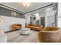 Well-lit living room features stylish furniture, modern design, and neutral décor at 14905 Skyscape Dr, Huntersville, NC 28078