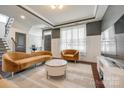 Cozy living room with large window, chic furnishings, and elegant interior design at 14905 Skyscape Dr, Huntersville, NC 28078