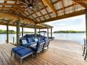 Waterfront covered dock area includes an outdoor seating area with lake view at 2045 Manila Bay Ln, Tega Cay, SC 29708