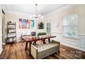 Bright home office featuring hardwood floors, modern lighting and a colorful accent wall at 2065 Taney Way, Indian Land, SC 29707