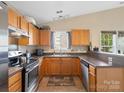 Functional kitchen with stainless steel appliances, ample counter space, and wood cabinetry at 3005 Kansas City Dr, Monroe, NC 28110