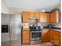 Well-equipped kitchen with stainless steel refrigerator, stove, and oven at 3005 Kansas City Dr, Monroe, NC 28110
