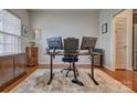 Home office with hardwood floors, two windows, and a large work space setup for maximum productivity at 4011 Fenworth Ct, Fort Mill, SC 29715