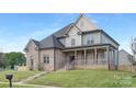 Beautiful two-story home featuring a classic design and inviting entrance at 4036 Meadowview Hills Dr # 7, Charlotte, NC 28269