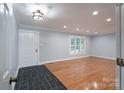 Inviting living room with refinished floors, ample light, and open doorway at 4256 Wood Forest Dr, Rock Hill, SC 29732
