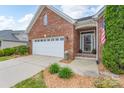 Beautiful brick home featuring an attached garage and lovely landscaping at 5135 Norway Ln, Rock Hill, SC 29732