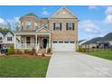Attractive brick home boasting a well-maintained lawn and an attached two-car garage at 620 Baneberry Bluff Ct, Rock Hill, SC 29732