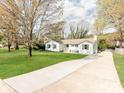 Inviting single Gathering home with a long driveway and well-maintained lawn at 6310 Welford Rd, Charlotte, NC 28211