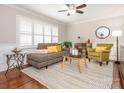Comfortable living room with stylish furniture and a ceiling fan at 7024 Rockledge Dr, Charlotte, NC 28210