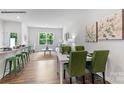 Open-concept living area with a dining space features bright natural light and modern decor at 729 Wagon Cross Ct, York, SC 29745